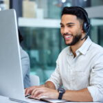 businessman using a computer while working in a call center