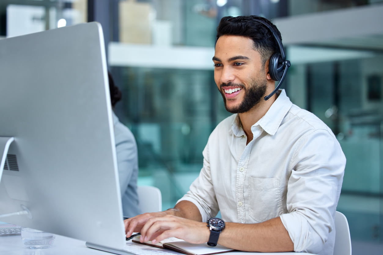 businessman using a computer while working in a call center