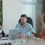 Three people in a meeting room